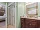 Bathroom with a marble countertop, wooden drawers, mirror and a closet across the room at 6001-T36 South Kings Hwy., Myrtle Beach, SC 29575