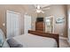 A bedroom showcasing two closets, a dresser with a television, and ensuite bathroom at 6001-T36 South Kings Hwy., Myrtle Beach, SC 29575