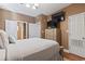 A bedroom featuring a wall-mounted television and multiple entryways at 6001-T36 South Kings Hwy., Myrtle Beach, SC 29575