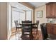 Cozy dining area with natural light, hardwood floors, and seating for four provides a warm and inviting atmosphere at 6001-T36 South Kings Hwy., Myrtle Beach, SC 29575