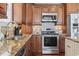 Well-appointed kitchen with stainless steel appliances, granite countertops, and custom cabinetry, ideal for cooking enthusiasts at 6001-T36 South Kings Hwy., Myrtle Beach, SC 29575