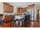 Beautiful kitchen features a center island, stainless steel appliances, granite countertops, and rich wood cabinetry at 6001-T36 South Kings Hwy., Myrtle Beach, SC 29575