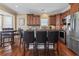A spacious kitchen featuring brown cabinets, stainless steel appliances and a dining area at 6001-T36 South Kings Hwy., Myrtle Beach, SC 29575