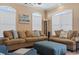 Comfortable living area featuring plush sofas, arched windows, and neutral decor providing a relaxing atmosphere at 6001-T36 South Kings Hwy., Myrtle Beach, SC 29575