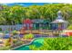 Charming mini-golf course with colorful buildings and fun obstacles, set in a lush, green landscape for Gathering entertainment at 6001-T36 South Kings Hwy., Myrtle Beach, SC 29575
