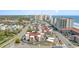 Aerial view showcasing community buildings, surrounding city, beaches, and ocean in the distance at 609 Hillside Dr. S # C-10, North Myrtle Beach, SC 29582