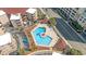 Aerial view of community pool, common areas, surrounding condo buildings, and nearby streets at 609 Hillside Dr. S # C-10, North Myrtle Beach, SC 29582