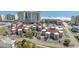 Aerial view capturing a community's charming architecture, landscaping, nearby beaches, and ocean views at 609 Hillside Dr. S # C-10, North Myrtle Beach, SC 29582