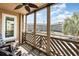 Relaxing screened balcony with ceiling fan, chairs and views of palms, building, and beach at 609 Hillside Dr. S # C-10, North Myrtle Beach, SC 29582