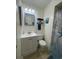 Well-maintained bathroom featuring a single sink vanity, blue framed mirror and beach themed decor at 609 Hillside Dr. S # C-10, North Myrtle Beach, SC 29582