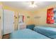 Bedroom featuring two twin beds, a dresser, and a bright, welcoming atmosphere at 609 Hillside Dr. S # C-10, North Myrtle Beach, SC 29582