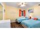Comfortable bedroom showcasing two twin beds, bright curtains, and beachy accents at 609 Hillside Dr. S # C-10, North Myrtle Beach, SC 29582