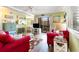 A sun-filled living room with wood floors, stylish decor, and access to balcony at 609 Hillside Dr. S # C-10, North Myrtle Beach, SC 29582