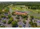 Aerial view of the golf course, clubhouse and parking lot, showcasing the community's amenities at 6253 Catalina Dr. # 1533, North Myrtle Beach, SC 29582