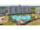 Aerial view of the resort showcasing a large pool, lush landscaping and luxurious condominiums at 6253 Catalina Dr. # 1533, North Myrtle Beach, SC 29582