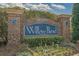 Willow Bend community entrance sign featuring brick pillars, lush landscaping, and a welcoming atmosphere at 6253 Catalina Dr. # 1533, North Myrtle Beach, SC 29582