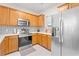 Bright kitchen with stainless steel appliances and wood cabinets at 6253 Catalina Dr. # 1533, North Myrtle Beach, SC 29582
