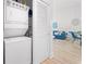 Laundry room featuring a stacked washer and dryer off of the entry to the living room at 6253 Catalina Dr. # 1533, North Myrtle Beach, SC 29582