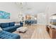 Open-concept living room with modern lighting fixtures, blue accent wall, and stylish furnishings at 6253 Catalina Dr. # 1533, North Myrtle Beach, SC 29582