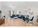 Bright living room with modern lighting, blue furniture, and wood floors at 6253 Catalina Dr. # 1533, North Myrtle Beach, SC 29582