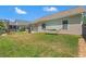 Expansive backyard featuring a hammock, outdoor grill area, and well-maintained lawn at 6485 Royal Pine Dr., Myrtle Beach, SC 29588