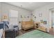 Adorable Bedroom with a soft rug, comfortable seating, and a well-equipped bookshelf at 6485 Royal Pine Dr., Myrtle Beach, SC 29588