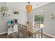 Cozy dining nook with a wooden table, stylish lighting, and a view of the outdoors at 6485 Royal Pine Dr., Myrtle Beach, SC 29588