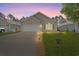 Charming single-story home featuring a well-manicured lawn and a two-car garage on a peaceful street at 6485 Royal Pine Dr., Myrtle Beach, SC 29588