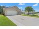 Charming home with a well-manicured lawn, spacious driveway, and attached two-car garage at 6485 Royal Pine Dr., Myrtle Beach, SC 29588