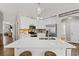 Bright kitchen featuring a marble-top island with sink, pendant lighting, and stainless-steel appliances at 6485 Royal Pine Dr., Myrtle Beach, SC 29588
