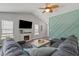 Inviting living room featuring a cozy fireplace, stylish decor, and a large sectional sofa at 6485 Royal Pine Dr., Myrtle Beach, SC 29588