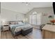Spacious main bedroom with vaulted ceiling, large bed, and ample natural light from the window at 6485 Royal Pine Dr., Myrtle Beach, SC 29588