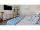 Comfortable bedroom featuring a dresser, blue accents, and a peaceful ambiance at 6485 Royal Pine Dr., Myrtle Beach, SC 29588