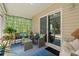 Cozy covered patio with comfortable seating and charming decor, perfect for relaxation at 6485 Royal Pine Dr., Myrtle Beach, SC 29588