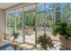 Bright sunroom with views of the lush backyard, providing a serene indoor/outdoor space at 6485 Royal Pine Dr., Myrtle Beach, SC 29588