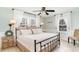 Bright bedroom with a wrought iron bed, neutral tones, and plenty of natural light at 668 S Waccamaw Dr., Murrells Inlet, SC 29576