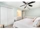 Comfortable bedroom with a ceiling fan, closet, and serene atmosphere at 668 S Waccamaw Dr., Murrells Inlet, SC 29576