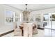 Bright dining room featuring a wooden table and decorative chandelier at 668 S Waccamaw Dr., Murrells Inlet, SC 29576