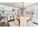 Dining area adjacent to the kitchen with an elegant chandelier at 668 S Waccamaw Dr., Murrells Inlet, SC 29576