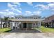 Charming coastal home featuring a covered parking area and easy beach access at 668 S Waccamaw Dr., Murrells Inlet, SC 29576