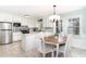 Eat-in kitchen features stainless steel appliances and a dining table that seats six at 668 S Waccamaw Dr., Murrells Inlet, SC 29576