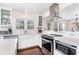 Well-appointed kitchen featuring stainless steel appliances and counter seating at 668 S Waccamaw Dr., Murrells Inlet, SC 29576
