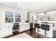 Bright, white kitchen features a breakfast bar and work space at 668 S Waccamaw Dr., Murrells Inlet, SC 29576