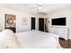 Spacious bedroom with wood floors and neutral tones with attached ensuite at 668 S Waccamaw Dr., Murrells Inlet, SC 29576