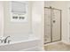 Bathroom featuring a soaking tub and a separate glass-enclosed shower at 700 Lorenzo Dr., North Myrtle Beach, SC 29582