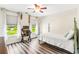 Bright bedroom featuring wood floors, desk with large windows, and great natural light at 700 Lorenzo Dr., North Myrtle Beach, SC 29582