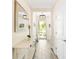 Bright entryway featuring a console table, decor mirror, decorative lights, and views of outdoors at 700 Lorenzo Dr., North Myrtle Beach, SC 29582