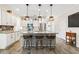 Kitchen with island, breakfast bar seating, stainless appliances, pendant lighting and tiled backsplash at 700 Lorenzo Dr., North Myrtle Beach, SC 29582