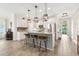 Kitchen features a central island, granite countertops, stainless appliances, and a mosaic backsplash at 700 Lorenzo Dr., North Myrtle Beach, SC 29582