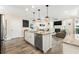 Kitchen featuring a center island, stainless steel appliances, granite countertops, and an open concept living space at 700 Lorenzo Dr., North Myrtle Beach, SC 29582